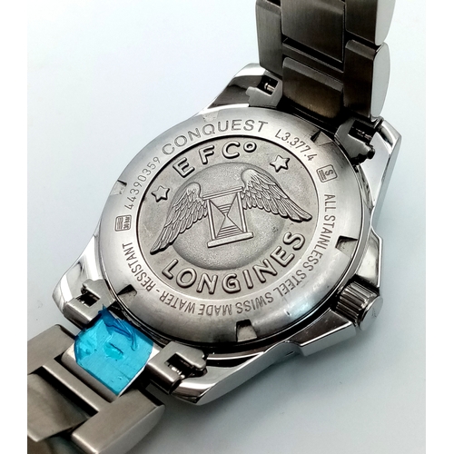 668 - A Longines Conquest Quartz Ladies Watch. Stainless steel bracelet and case - 34mm. Tiffany blue dial... 