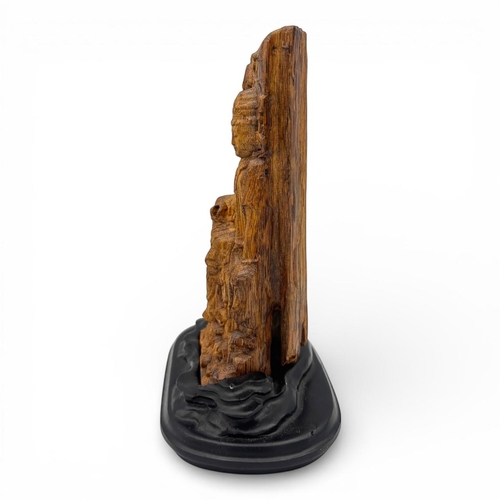 1187 - A wonderful Natural agarwood hand-carved relief depicting a seated Buddhist figure accompanied by a ... 