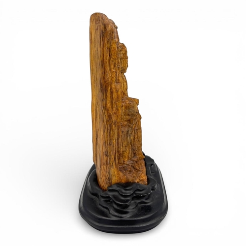 1187 - A wonderful Natural agarwood hand-carved relief depicting a seated Buddhist figure accompanied by a ... 