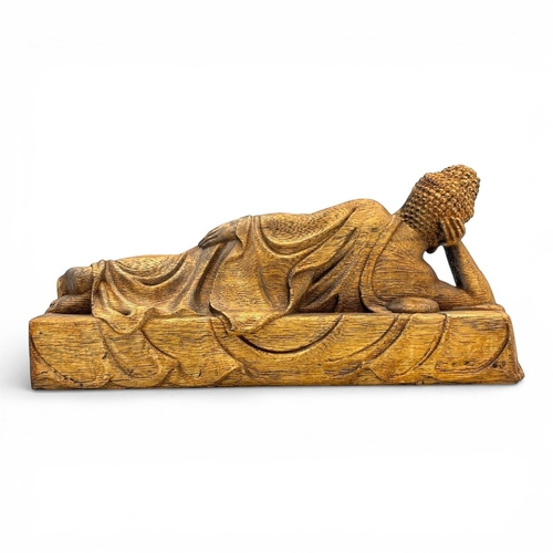 1201 - A magnificent Natural agarwood hand carved  of a reclining Buddha resting on a lotus platform.
The n... 