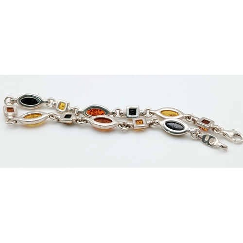 1260 - A Baltic Amber Multi-Colour Link Bracelet. Silver settings. Measured 20cm as flat. Never worn. Made ... 