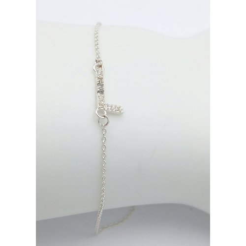 1154 - A STERlING SILVER, INITIAL L, STONE SET, BRACELET. A/S SIL 21