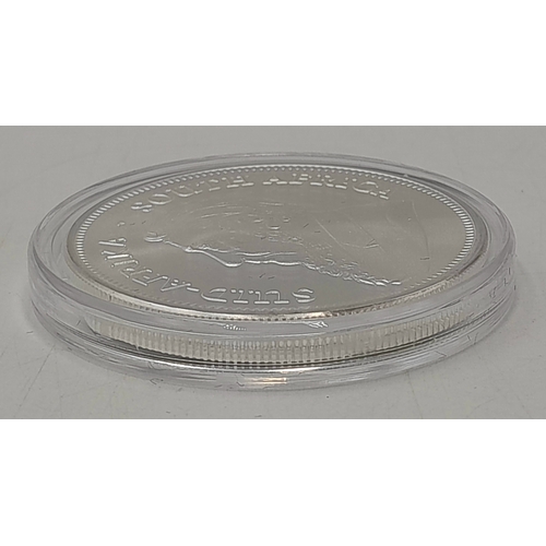 1163 - A Fine Silver (.999) 1oz South African Krugerrand Coin. Brilliant uncirculated. Comes with COA and c... 