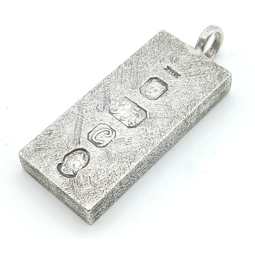38 - A Sterling Silver Queen Elizabeth II Jubilee Ingot Pendant. 4.5cm. 31.8g