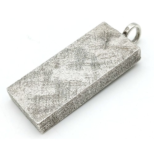 38 - A Sterling Silver Queen Elizabeth II Jubilee Ingot Pendant. 4.5cm. 31.8g
