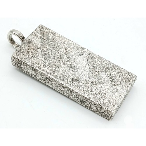 38 - A Sterling Silver Queen Elizabeth II Jubilee Ingot Pendant. 4.5cm. 31.8g