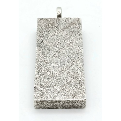 38 - A Sterling Silver Queen Elizabeth II Jubilee Ingot Pendant. 4.5cm. 31.8g