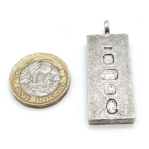 38 - A Sterling Silver Queen Elizabeth II Jubilee Ingot Pendant. 4.5cm. 31.8g