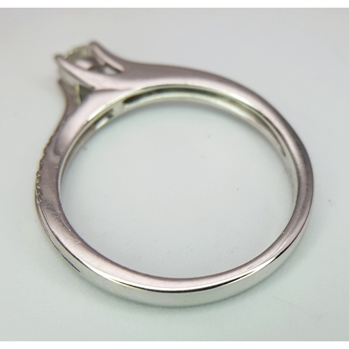 25 - An 18K White Gold Diamond Ring. A round brilliant cut 0.25ct diamond having G-H colour with VS2 clar... 