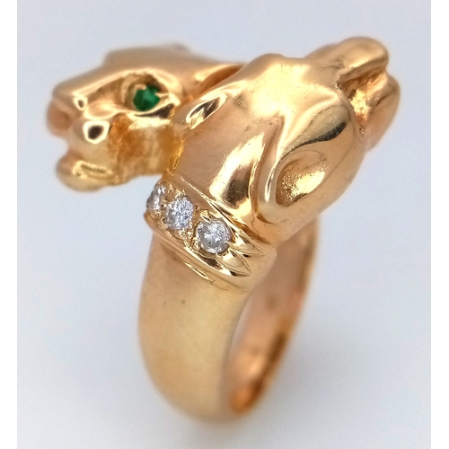 37 - A 14K Yellow Gold, Emerald and Diamond Twin Panther Crossover Ring. Emerald eyes and diamond set nec... 