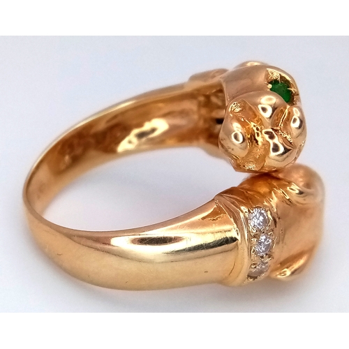37 - A 14K Yellow Gold, Emerald and Diamond Twin Panther Crossover Ring. Emerald eyes and diamond set nec... 