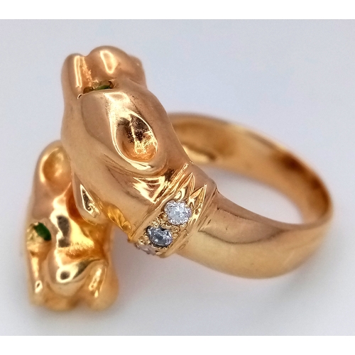 37 - A 14K Yellow Gold, Emerald and Diamond Twin Panther Crossover Ring. Emerald eyes and diamond set nec... 