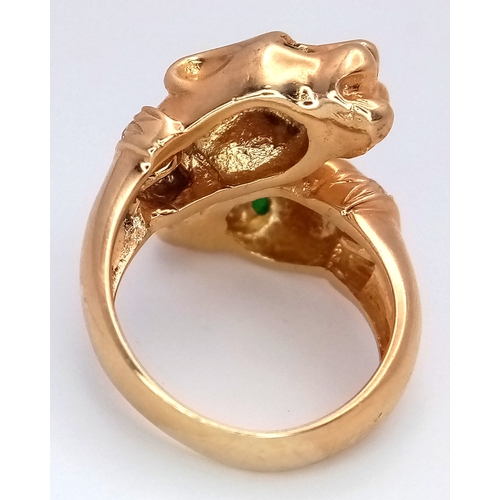 37 - A 14K Yellow Gold, Emerald and Diamond Twin Panther Crossover Ring. Emerald eyes and diamond set nec... 