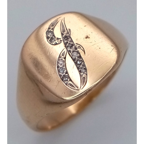 44 - A 9K Yellow Gold Diamond Set Letter 'J' Signet Ring. Size T. 5.1g.