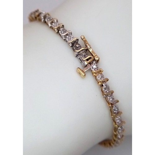 520 - A 9K Yellow Gold Diamond Tennis Bracelet. 18cm. 4.48g.