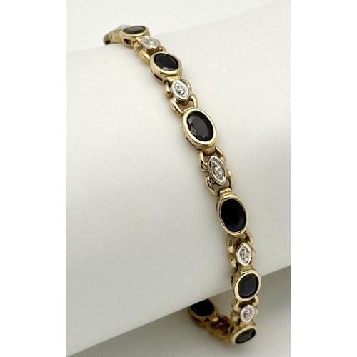 521 - A 9K Yellow Gold Diamond and Sapphire Bracelet. Oval cut sapphires and small round brilliant cut dia... 