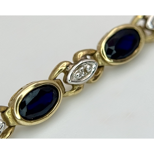 521 - A 9K Yellow Gold Diamond and Sapphire Bracelet. Oval cut sapphires and small round brilliant cut dia... 