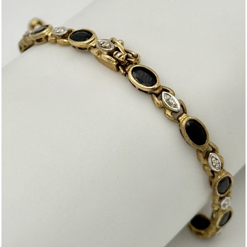 521 - A 9K Yellow Gold Diamond and Sapphire Bracelet. Oval cut sapphires and small round brilliant cut dia... 