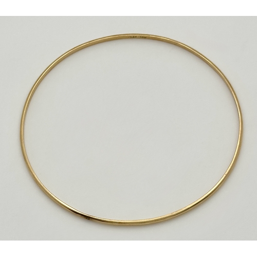 527 - A 14K Yellow Gold Thin Bangle. 3mm width. 62mm inner diameter. 5.05g.