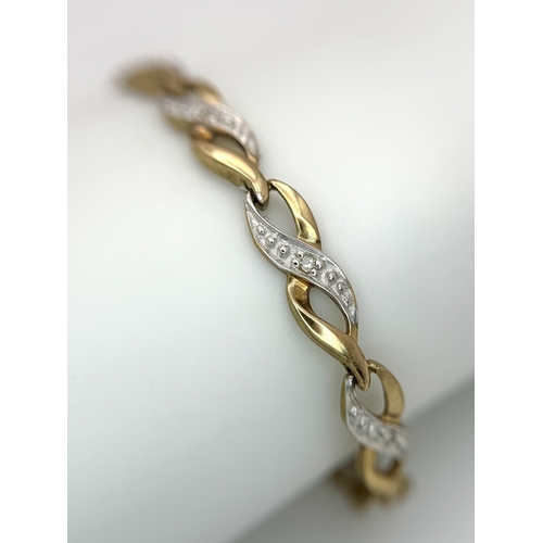 528 - A 9K Yellow and White Gold Twist Link Bracelet. 19cm. 6.05g.