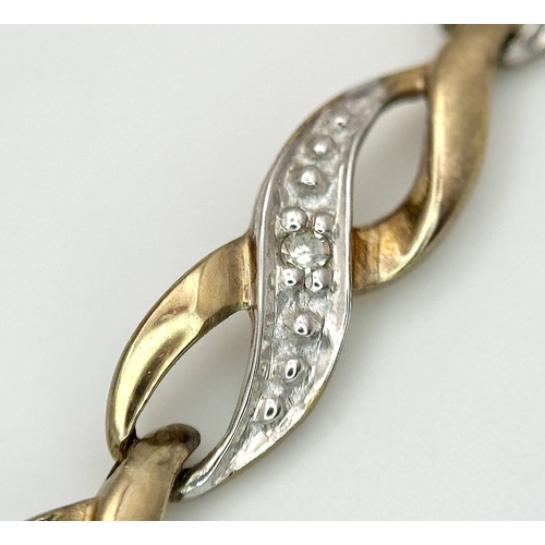 528 - A 9K Yellow and White Gold Twist Link Bracelet. 19cm. 6.05g.