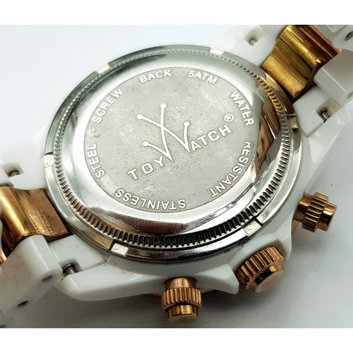A TOY WATCH, CHRONOGRAPH, ROSE GOLD TONE AND WHITE PLASTIC BRACELET WATCH.  IN FULL WORKING ORDER. NE