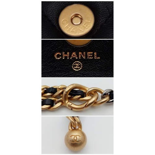 5 - A Chanel 19 Black Leather Wallet On Chain. Black quilted leather exterior with mixed gold and silver... 