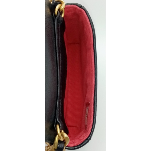 5 - A Chanel 19 Black Leather Wallet On Chain. Black quilted leather exterior with mixed gold and silver... 