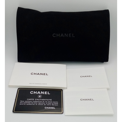 5 - A Chanel 19 Black Leather Wallet On Chain. Black quilted leather exterior with mixed gold and silver... 