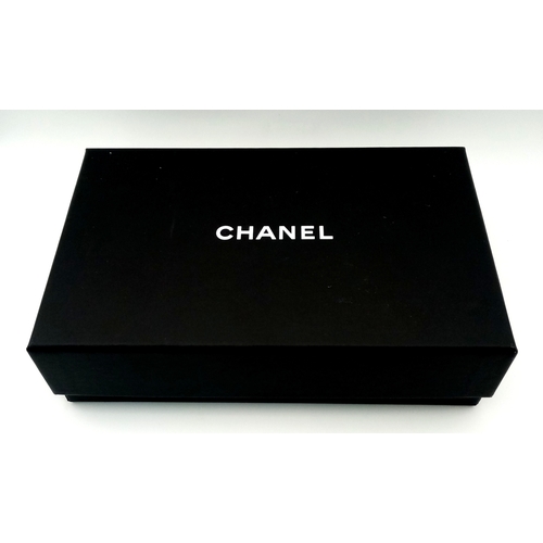 5 - A Chanel 19 Black Leather Wallet On Chain. Black quilted leather exterior with mixed gold and silver... 