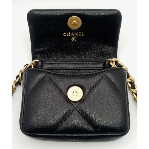 5 - A Chanel 19 Black Leather Wallet On Chain. Black quilted leather exterior with mixed gold and silver... 