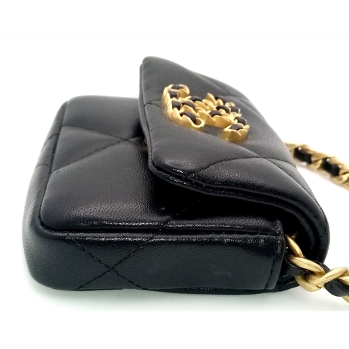 5 - A Chanel 19 Black Leather Wallet On Chain. Black quilted leather exterior with mixed gold and silver... 