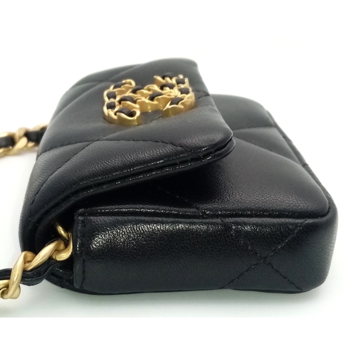 5 - A Chanel 19 Black Leather Wallet On Chain. Black quilted leather exterior with mixed gold and silver... 
