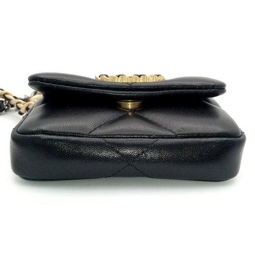 5 - A Chanel 19 Black Leather Wallet On Chain. Black quilted leather exterior with mixed gold and silver... 