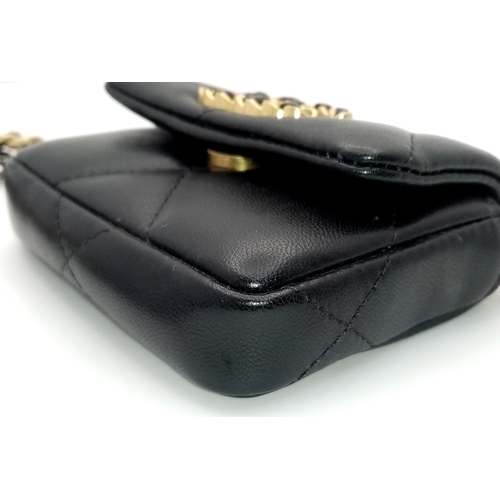 5 - A Chanel 19 Black Leather Wallet On Chain. Black quilted leather exterior with mixed gold and silver... 