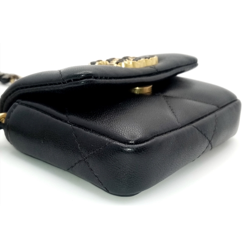 5 - A Chanel 19 Black Leather Wallet On Chain. Black quilted leather exterior with mixed gold and silver... 