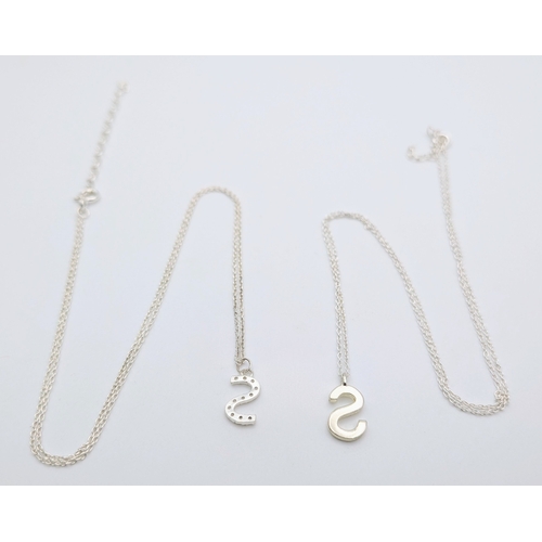 1210 - A PAIR OF STERLING SILVER NECKLACES WITH INITIAL S PENDANTS. ONE IS STONE SET. TOTAL WEIGHT 2.9G. A/... 