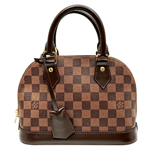 33 - A Brown Louis Vuitton Damier Ebene Alma BB Handbag. Brown textile exterior with gold-tone hardware, ... 