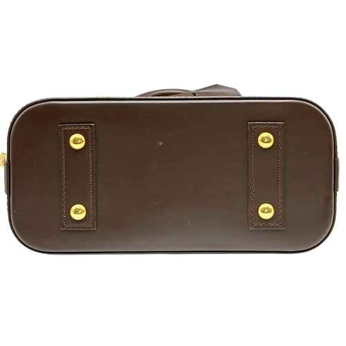33 - A Brown Louis Vuitton Damier Ebene Alma BB Handbag. Brown textile exterior with gold-tone hardware, ... 