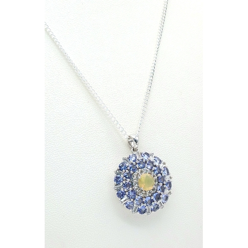 503 - A Beautiful Sterling Silver Hand Crafted Tanzanite, Opal and White Topaz
Pendant Necklace. 46cm Leng... 
