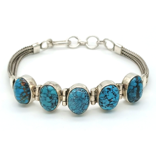 517 - A Well-Crafted Vintage Silver and Turquoise Bracelet- Fits 19-21cm Length.
Set with Five 1.4cm Long ... 