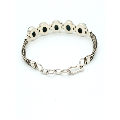 517 - A Well-Crafted Vintage Silver and Turquoise Bracelet- Fits 19-21cm Length.
Set with Five 1.4cm Long ... 