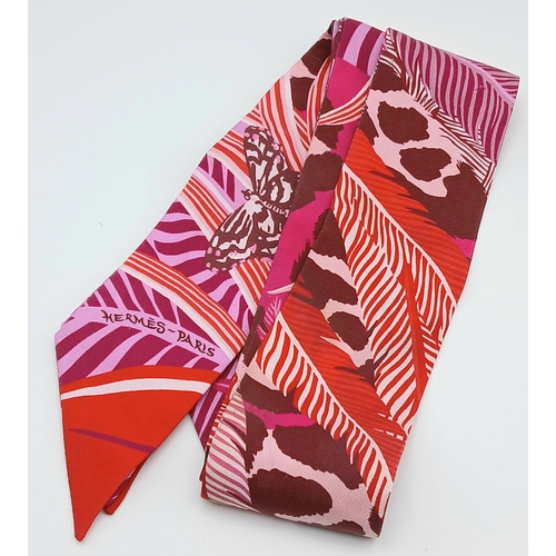 550 - Two Hermès “Jaguar Quetzal” Twilly Scarves. In a vibrant pink, rose and bordeaux colour palette with... 