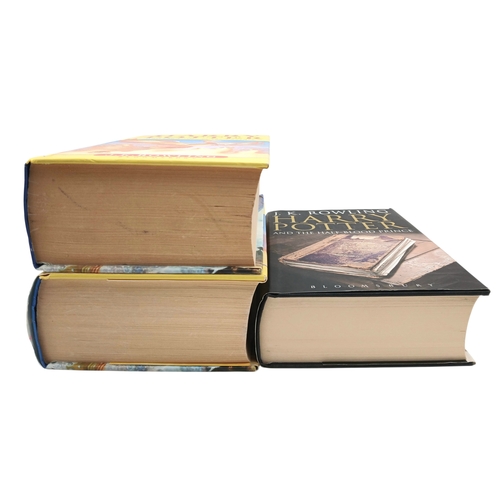 524 - A Parcel of Three First Edition Harry Potter Books Including the misprint edition of Harry Potter an... 