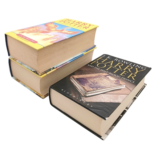 524 - A Parcel of Three First Edition Harry Potter Books Including the misprint edition of Harry Potter an... 