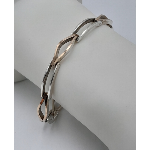 1175 - An 18k Yellow Gold plated on 950 Silver Modernist Design Bracelet- 20cm Length.
5.5mm Wide, the Brac... 