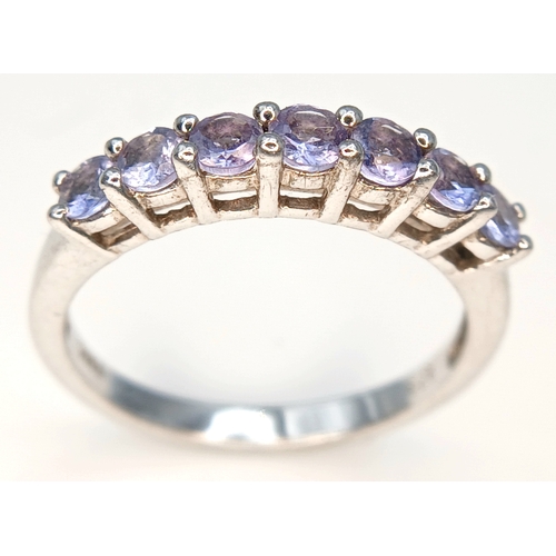 525 - Classic Slim  TANZANITE RING from The Genuine Gemstone Company. Having a Sweep of  7 x TANZANITE GEM... 