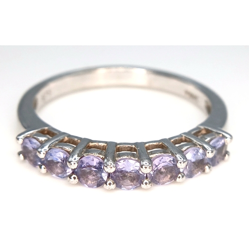 525 - Classic Slim  TANZANITE RING from The Genuine Gemstone Company. Having a Sweep of  7 x TANZANITE GEM... 