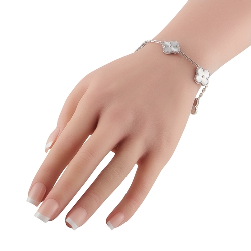 555 - A Van Cleef & Arpels Vintage AlhambrAn 18K White Gold Bracelet. The brands iconic clover-shaped moti... 