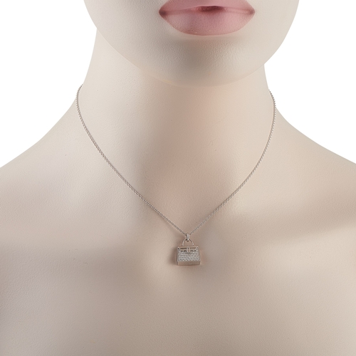 422 - A Hermes Amulettes Birkin 18K White Gold Diamond Pendant Necklace. A Birkin pendant takes center sta... 